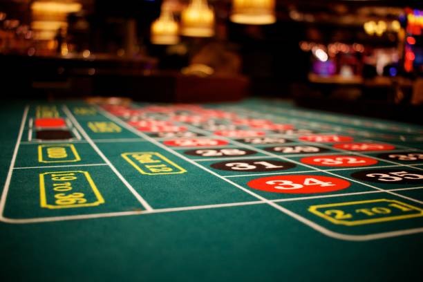 Mobile phone showing live roulette table with betting layout and dealer camera feed